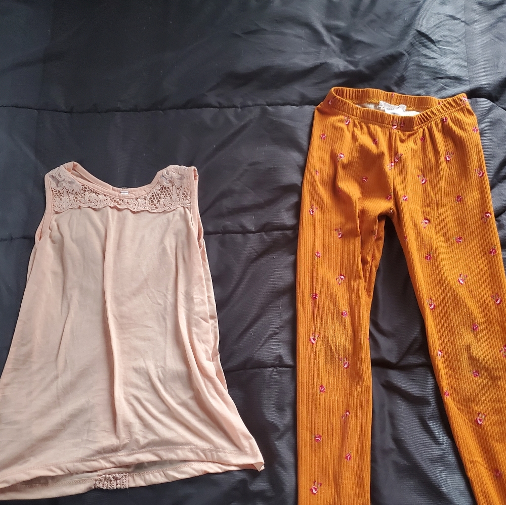 girl 10 orange ribbed leggings with pink flower print, light pink top